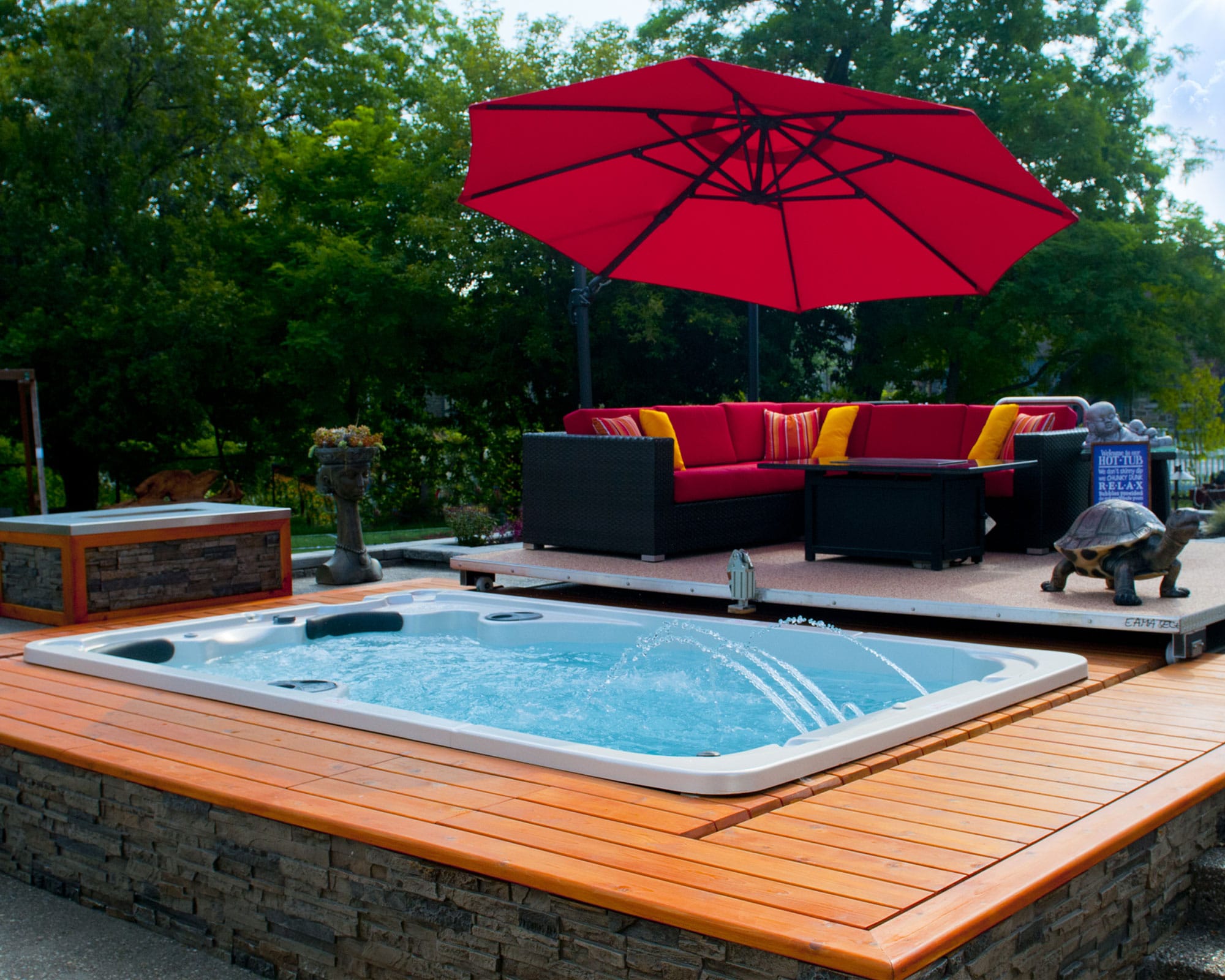 Luxury hot tub outdoors next to a sofa set